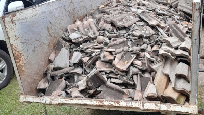 Clean tiles in skip bin ready for pick up